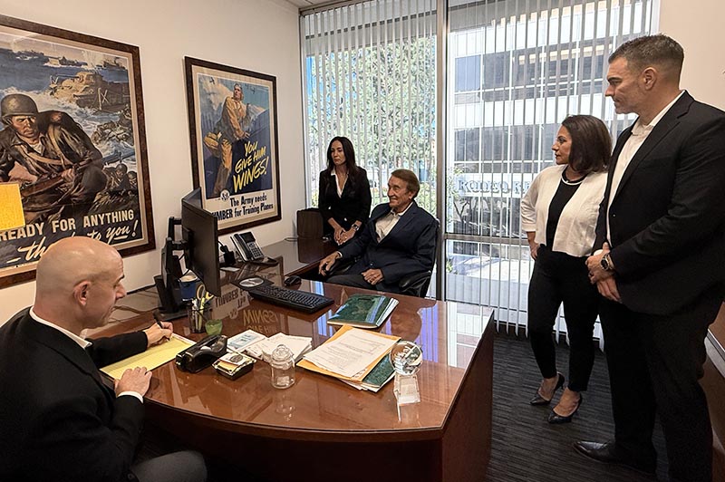 RL Thomas - office meeting